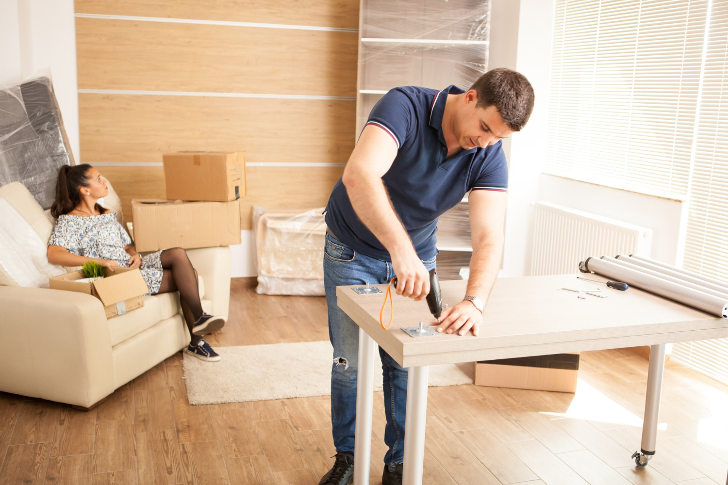 Man Putting Together Self-Assembly Furniture New Home Furniture New House